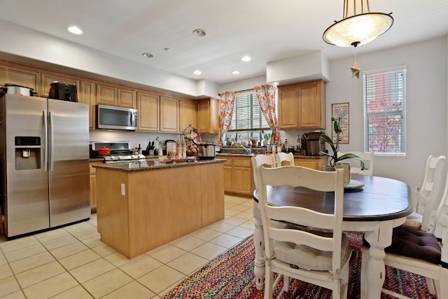1756 Camino Real Way, Roseville, CA 95747 - kitchen featuring stainless steel appliances, a center island, light tile patterned floors, pendant lighting, and recessed lighting
