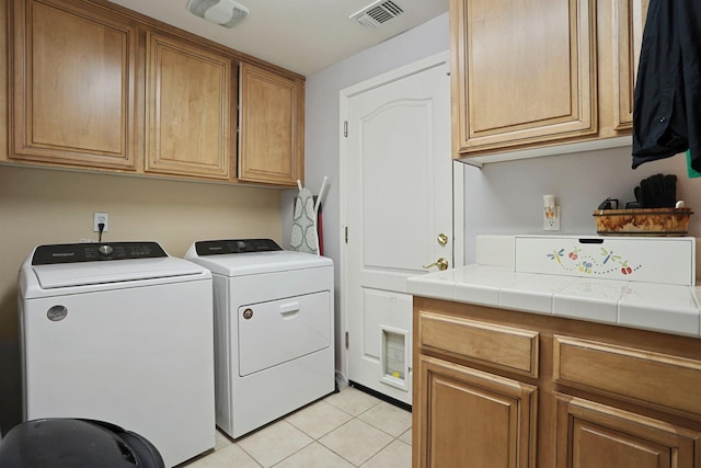 1756 Camino Real Way, Roseville, CA 95747 - laundry room featuring cabinet space, washing machine and clothes dryer, and light tile patterned flooring