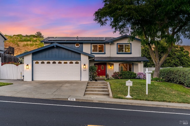 510 Hastings Dr, Benicia, CA 94510 - traditional home with roof mounted solar panels, a garage, concrete driveway, and stucco siding