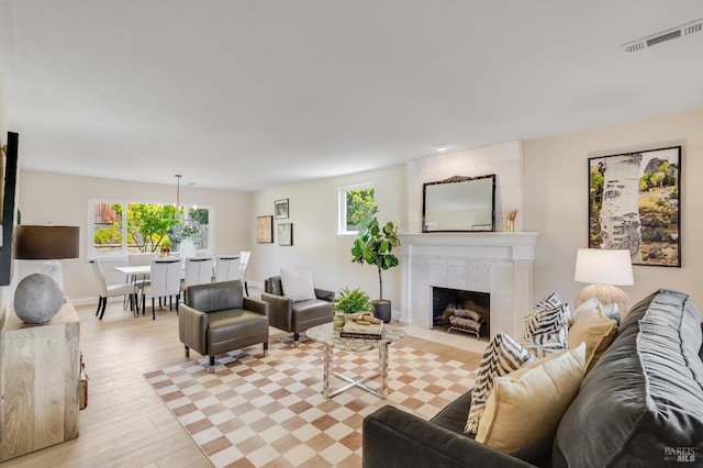 510 Hastings Dr, Benicia, CA 94510 - living room featuring healthy amount of natural light, light wood-style floors, and a tile fireplace