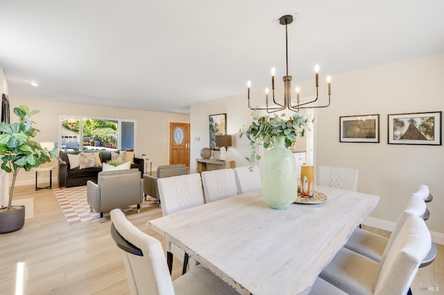 510 Hastings Dr, Benicia, CA 94510 - dining space with light wood-type flooring and a chandelier
