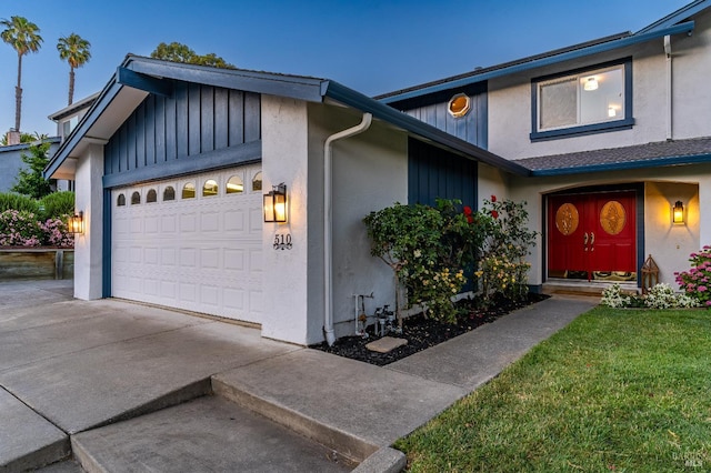 510 Hastings Dr, Benicia, CA 94510 - view of property featuring an attached garage, concrete driveway, stucco siding, and board and batten siding