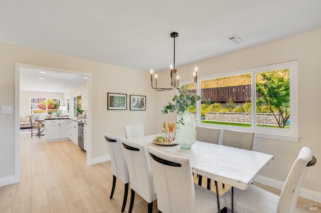 510 Hastings Dr, Benicia, CA 94510 - dining room with a chandelier and light wood finished floors