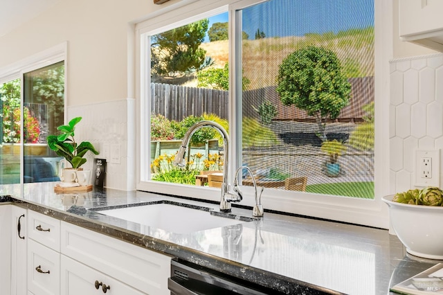 510 Hastings Dr, Benicia, CA 94510 - kitchen with white cabinets, dark stone countertops, healthy amount of natural light, and dishwasher