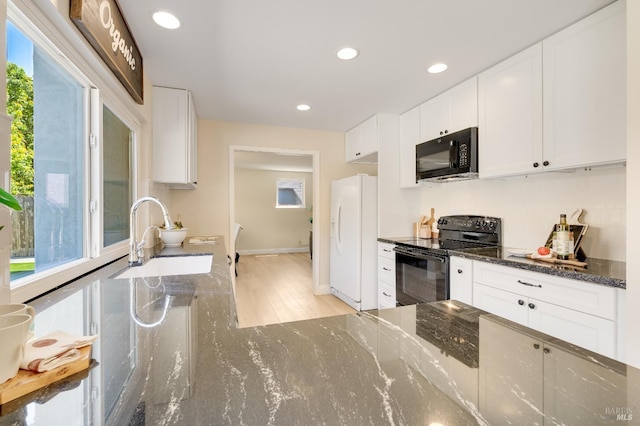 510 Hastings Dr, Benicia, CA 94510 - kitchen with black appliances, light wood-style flooring, white cabinetry, and recessed lighting