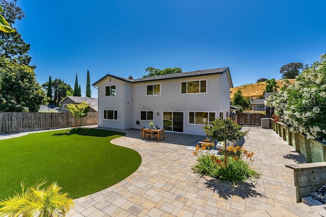 510 Hastings Dr, Benicia, CA 94510 - rear view of house with stucco siding, a fenced backyard, and a patio