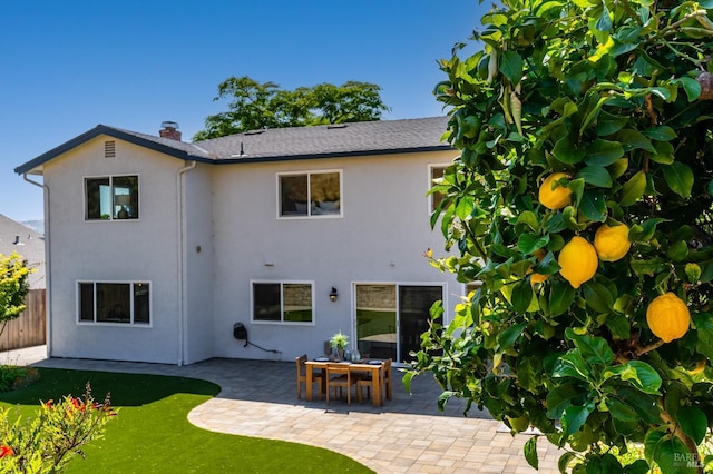 510 Hastings Dr, Benicia, CA 94510 - back of property with a patio area, stucco siding, and a chimney