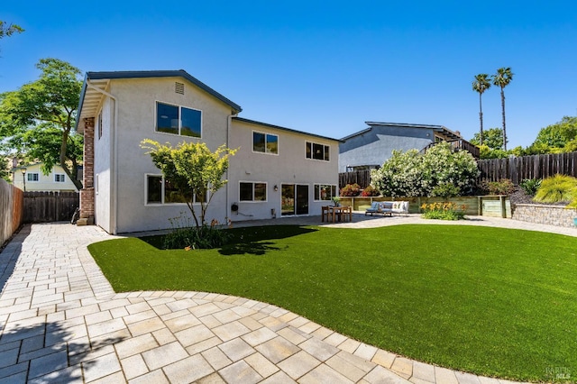 510 Hastings Dr, Benicia, CA 94510 - back of property featuring a patio, a fenced backyard, stucco siding, and an outdoor living space