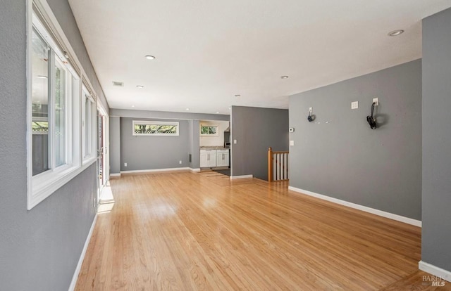 31 Buckelew St, Sausalito, CA 94965 - unfurnished living room with light wood-type flooring and baseboards