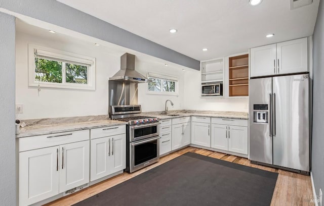 31 Buckelew St, Sausalito, CA 94965 - kitchen featuring appliances with stainless steel finishes, island range hood, open shelves, white cabinetry, and recessed lighting