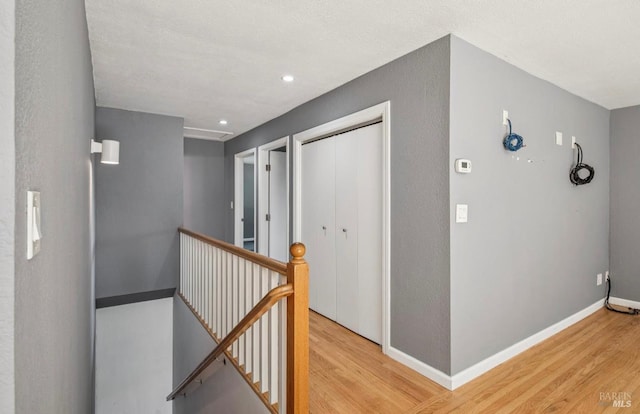 31 Buckelew St, Sausalito, CA 94965 - hall with an upstairs landing, light wood-style floors, and recessed lighting