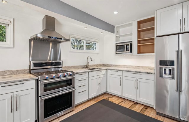 31 Buckelew St, Sausalito, CA 94965 - kitchen featuring appliances with stainless steel finishes, island range hood, open shelves, plenty of natural light, and recessed lighting