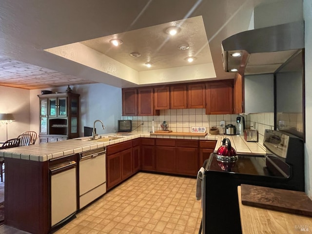 32691 Pearl Dr, Fort Bragg, CA 95437 - kitchen featuring range with electric stovetop, dishwasher, a peninsula, tile countertops, and tasteful backsplash