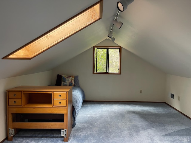 32691 Pearl Dr, Fort Bragg, CA 95437 - unfurnished bedroom with track lighting, carpet flooring, lofted ceiling, and a skylight