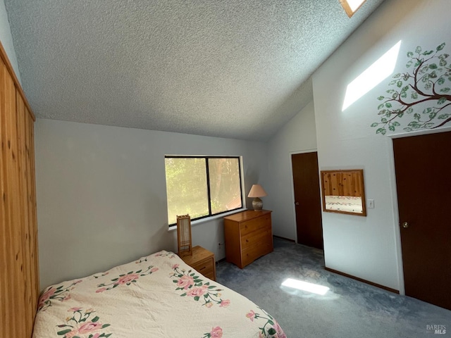 32691 Pearl Dr, Fort Bragg, CA 95437 - bedroom featuring a textured ceiling, carpet floors, lofted ceiling, and a skylight