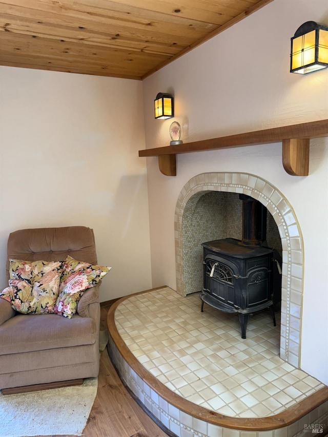 32691 Pearl Dr, Fort Bragg, CA 95437 - living area with a wood stove, wood ceiling, and wood finished floors
