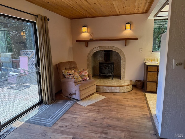32691 Pearl Dr, Fort Bragg, CA 95437 - living room with a wood stove, wood finished floors, and wood ceiling
