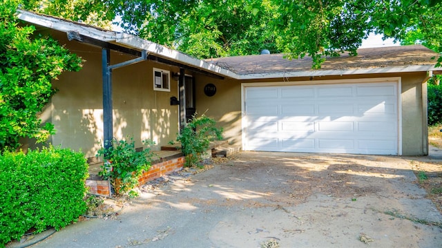 1701 Palm Pl, Davis, CA 95618 - view of front of property with a garage, stucco siding, and driveway