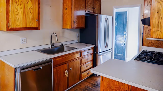 1701 Palm Pl, Davis, CA 95618 - kitchen featuring appliances with stainless steel finishes, light countertops, brown cabinetry, and ventilation hood