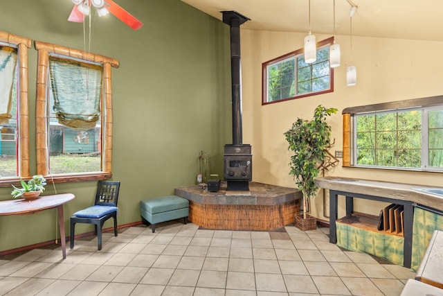 5338 Deception River Rd, Chico, CA 95928 - tiled living area featuring a wood stove, ceiling fan, and lofted ceiling