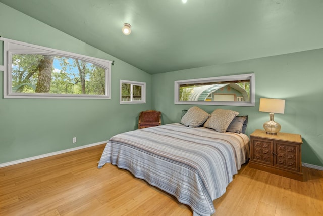 5338 Deception River Rd, Chico, CA 95928 - bedroom with lofted ceiling, multiple windows, and wood finished floors