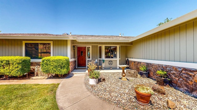 4389 Summit View Ranch Rd, Santa Rosa, CA 95404 - doorway to property featuring stone siding, a porch, and a shingled roof