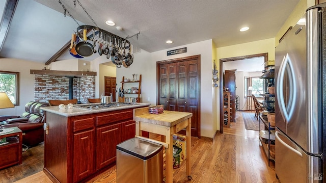 4389 Summit View Ranch Rd, Santa Rosa, CA 95404 - kitchen with appliances with stainless steel finishes, dark brown cabinets, light wood-style floors, recessed lighting, and a textured ceiling