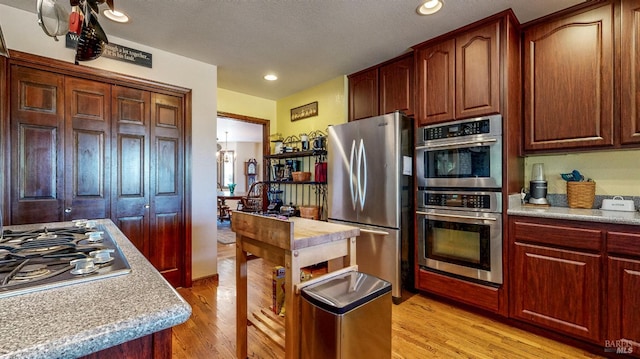 4389 Summit View Ranch Rd, Santa Rosa, CA 95404 - kitchen featuring appliances with stainless steel finishes, light countertops, light wood finished floors, and recessed lighting