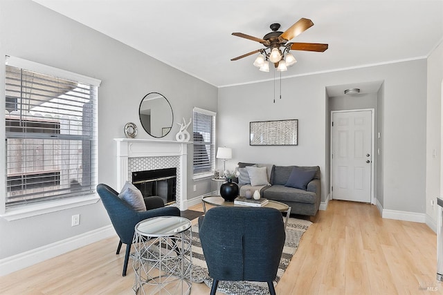 159 Suncliff Pl, Vallejo, CA 94591 - living room with wood finished floors, ceiling fan, a tiled fireplace, and crown molding