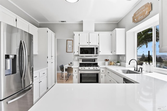 159 Suncliff Pl, Vallejo, CA 94591 - kitchen featuring stainless steel appliances, white cabinetry, light countertops, crown molding, and light wood-style floors