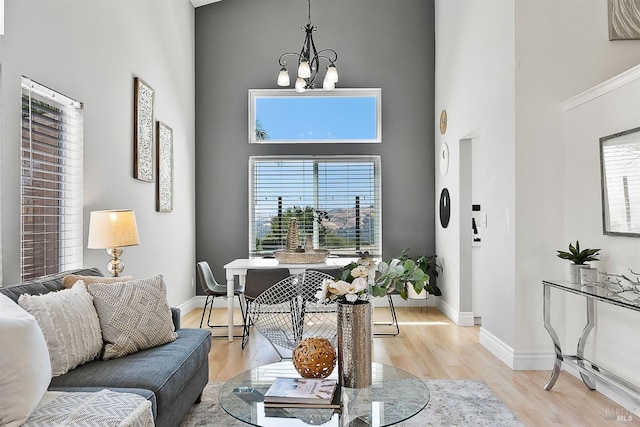159 Suncliff Pl, Vallejo, CA 94591 - living room featuring a chandelier, a towering ceiling, and light wood-style flooring