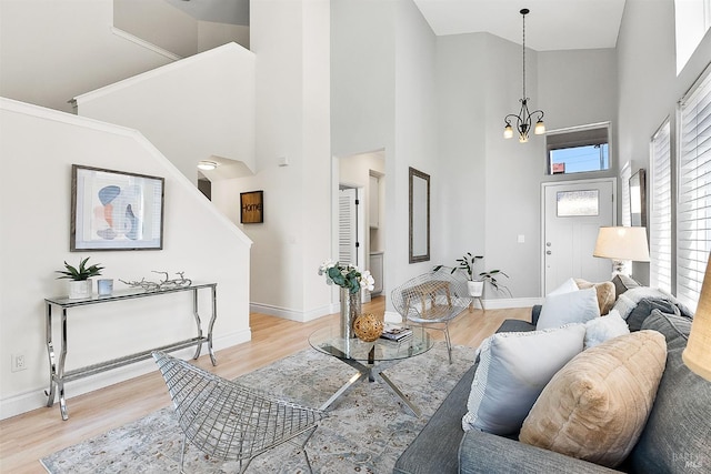 159 Suncliff Pl, Vallejo, CA 94591 - living room featuring light wood-type flooring, a towering ceiling, a chandelier, and stairs