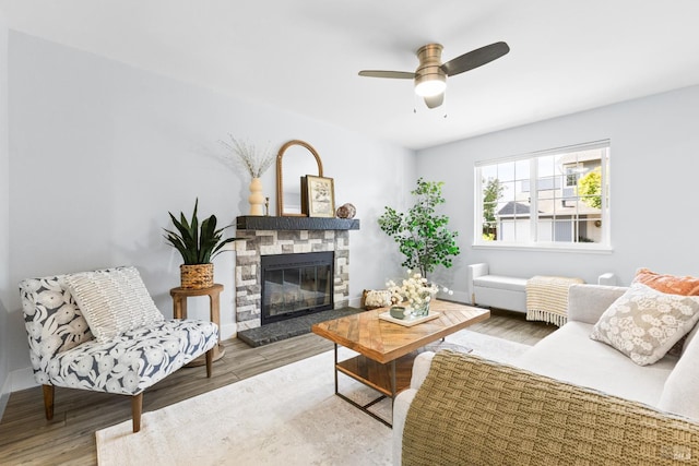 23 Ryan Ln, Cotati, CA 94931 - living room featuring wood finished floors, a ceiling fan, and a stone fireplace