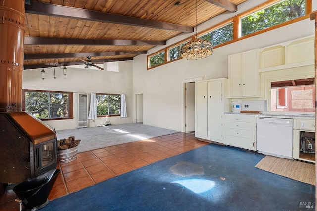 210 Valley View Dr, Petaluma, CA 94952 - unfurnished living room featuring high vaulted ceiling, a wood ceiling with exposed beams, ceiling fan, dark tile patterned floors, and healthy amount of natural light