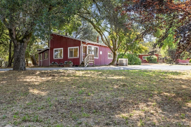 210 Valley View Dr, Petaluma, CA 94952 - view of front of home featuring a chimney, entry steps, and board and batten siding