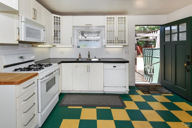 1388 Sulphur Springs Ave, Saint Helena, CA 94574 - kitchen featuring white appliances, tile patterned floors, backsplash, and white cabinets