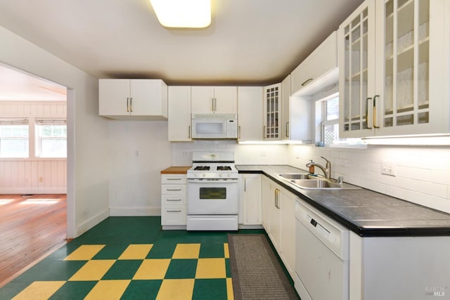 1388 Sulphur Springs Ave, Saint Helena, CA 94574 - kitchen with white appliances, dark flooring, backsplash, and healthy amount of natural light