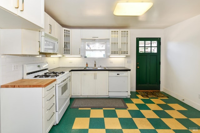 1388 Sulphur Springs Ave, Saint Helena, CA 94574 - kitchen featuring white appliances, tile patterned floors, backsplash, and white cabinetry