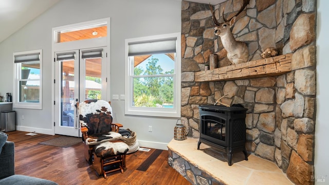 2570 Goodwin Ave, Penngrove, CA 94951 - living area with a wood stove, lofted ceiling, wood finished floors, and healthy amount of natural light