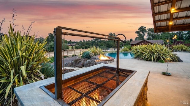 2570 Goodwin Ave, Penngrove, CA 94951 - pool at dusk with an outdoor fire pit, an outdoor pool, and a patio