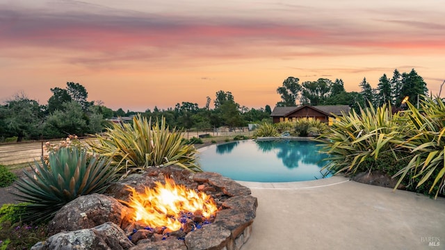 2570 Goodwin Ave, Penngrove, CA 94951 - pool at dusk featuring a fire pit and a patio