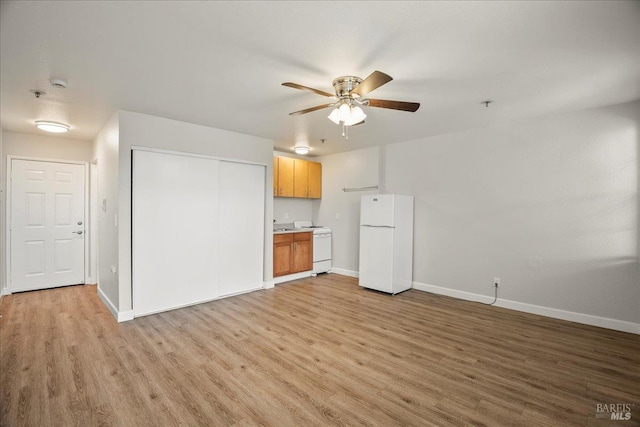 963 B St, Hayward, CA 94541 - unfurnished living room with light wood-type flooring and a ceiling fan