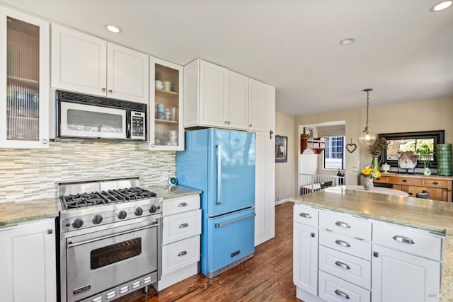 128 Walnut Ave, Mill Valley, CA 94941 - kitchen featuring premium appliances, dark wood-type flooring, white cabinetry, decorative backsplash, and recessed lighting