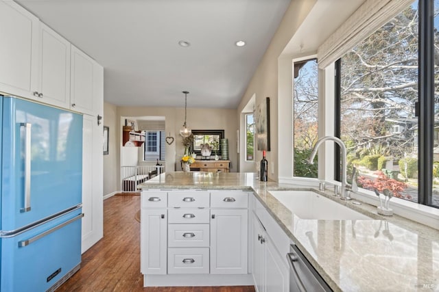 128 Walnut Ave, Mill Valley, CA 94941 - kitchen featuring high end fridge, light stone countertops, white cabinets, and recessed lighting