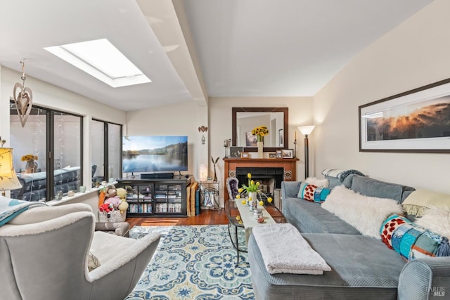 128 Walnut Ave, Mill Valley, CA 94941 - living room featuring wood finished floors, a fireplace, and a skylight