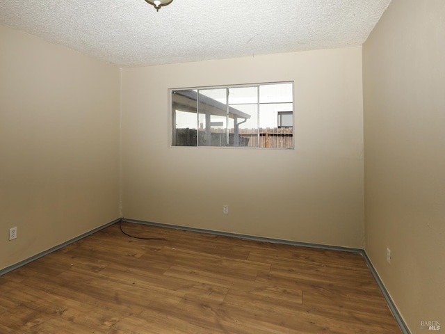 15190 Highlands Hbr, Clearlake, CA 95422 - unfurnished room with wood finished floors and a textured ceiling