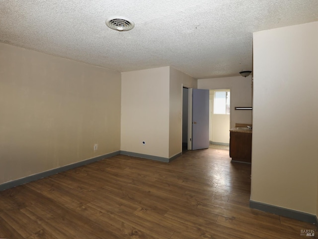 15190 Highlands Hbr, Clearlake, CA 95422 - empty room with a textured ceiling and wood finished floors