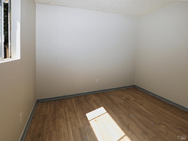 15190 Highlands Hbr, Clearlake, CA 95422 - spare room with wood finished floors and a textured ceiling