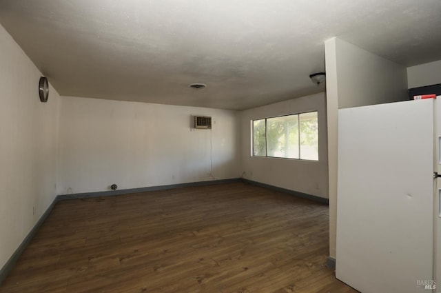 15190 Highlands Hbr, Clearlake, CA 95422 - spare room featuring dark wood finished floors and an AC wall unit