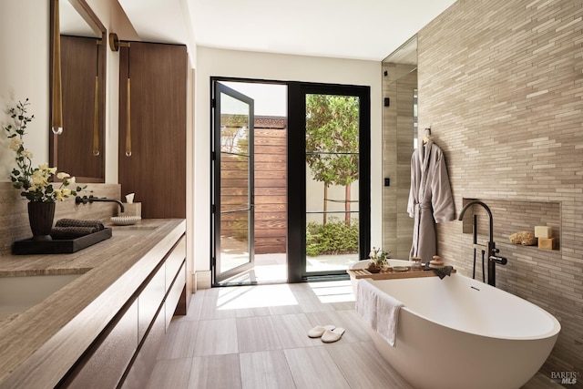 106 Vintners Ct, Napa, CA 94559 - full bathroom featuring a freestanding bath, double vanity, and brick wall